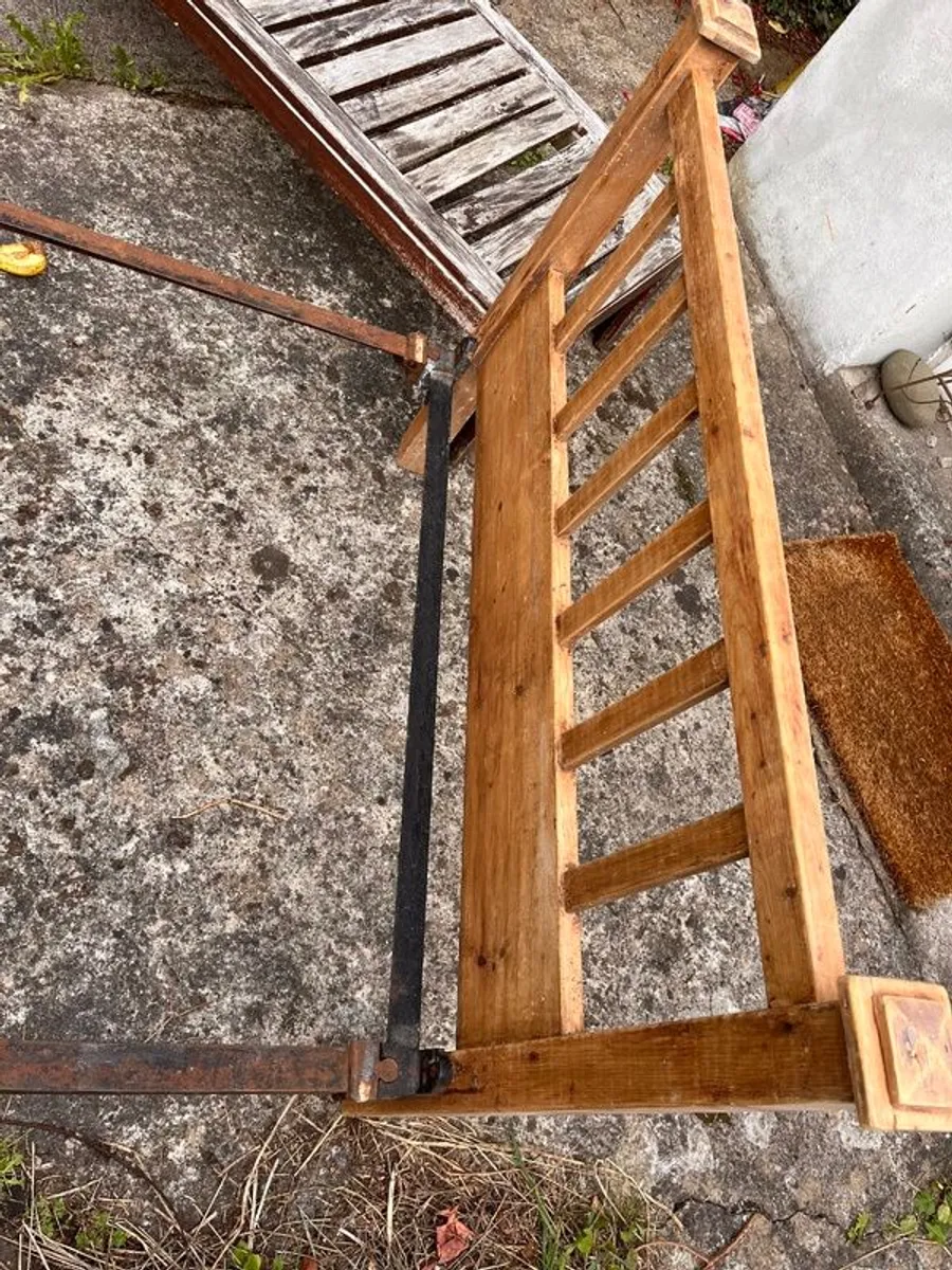 Antique pine bed ends and iron rails - Image 1