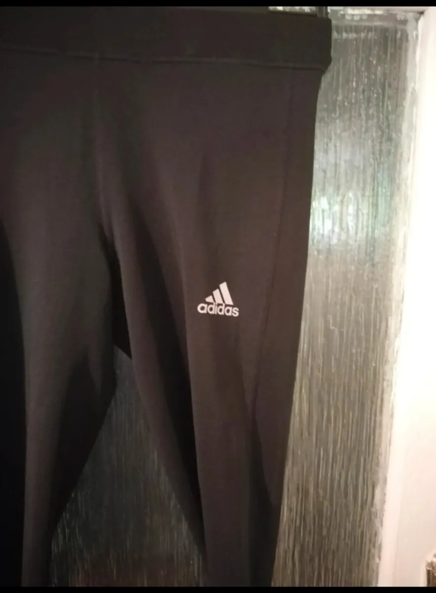 black Adidas Techfit leggings featuring white bran - Image 3