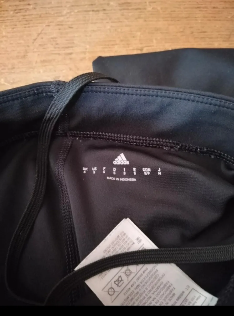 black Adidas Techfit leggings featuring white bran - Image 4