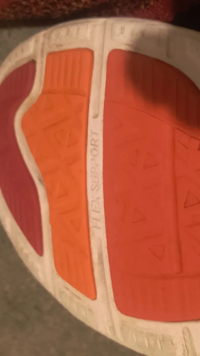 athletic sneaker features a red and black 9 - Image 3
