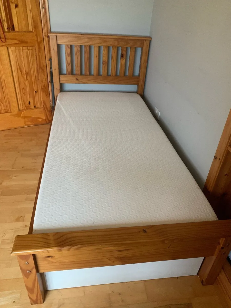 2 wooden single bed frames and mattresses