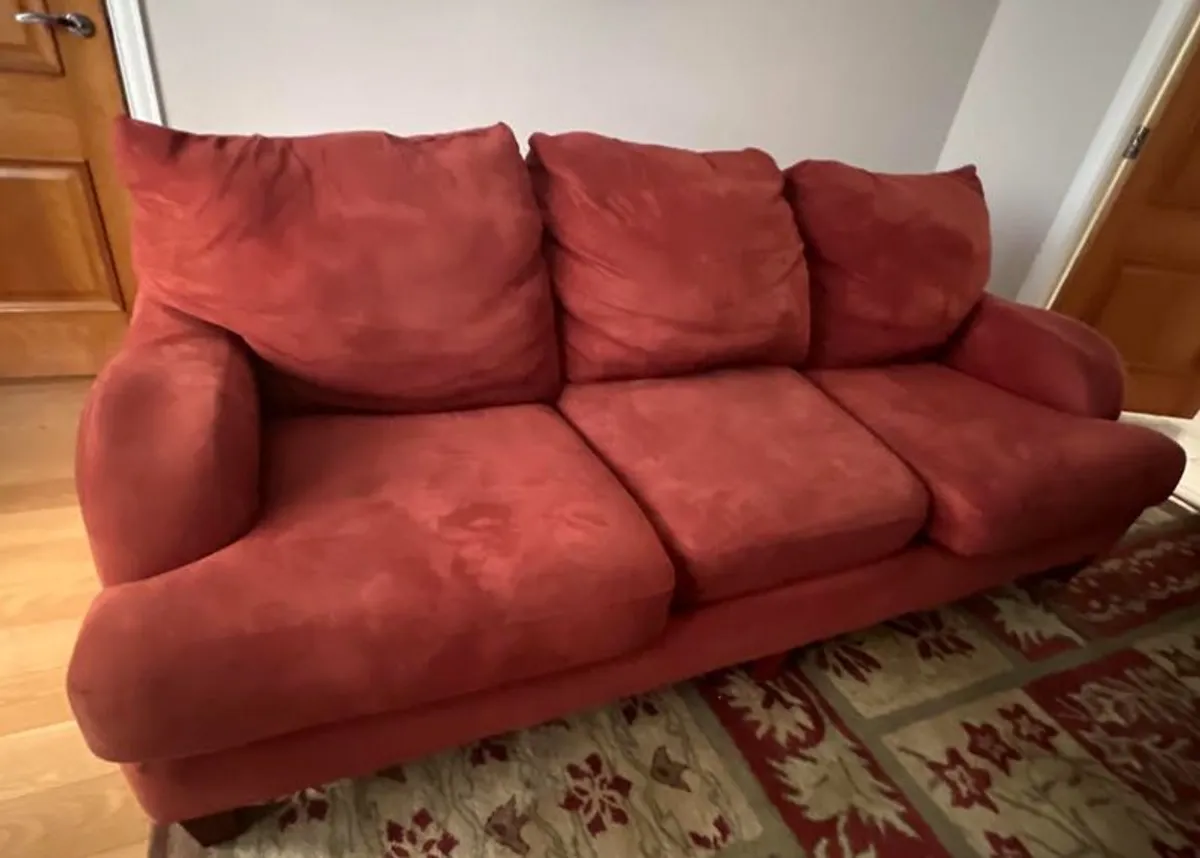 Three seater sofa in red fabric