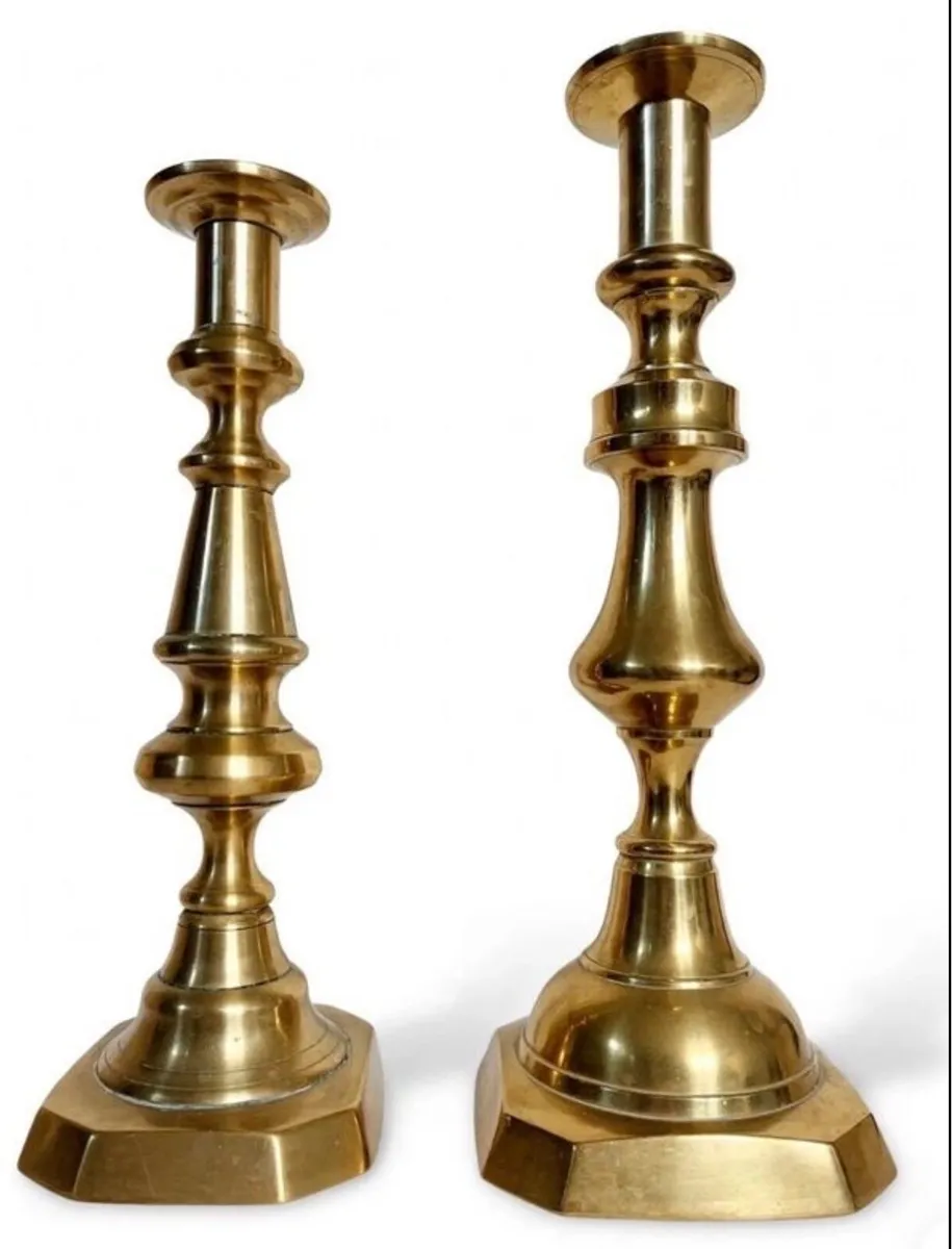 Graduating brass candle holders