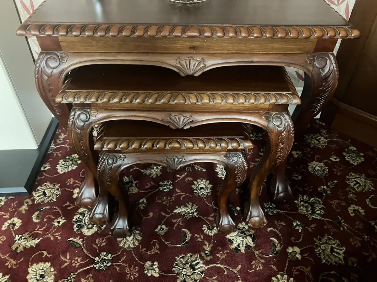 Trio of different sized wooden display tables