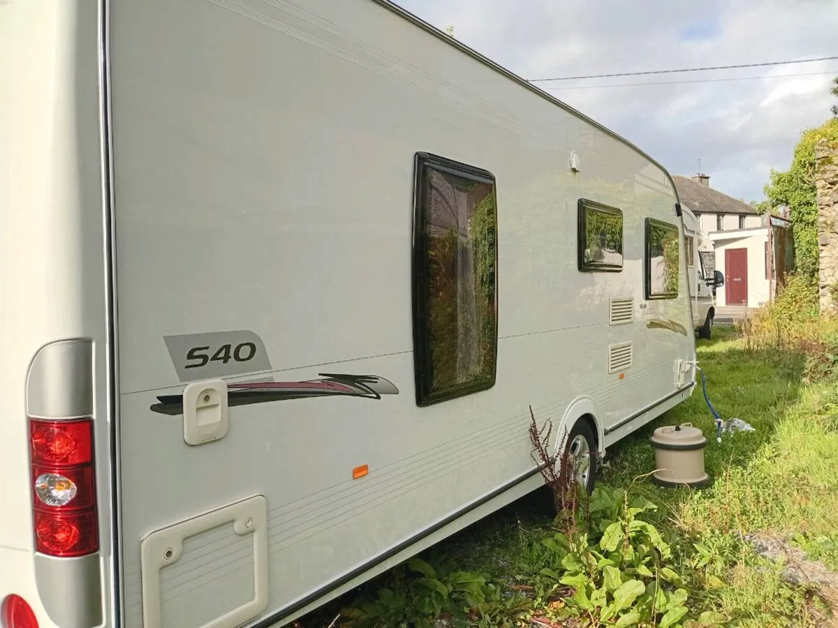 2012 model Elddis caravan 4 Berth end bedroom - Image 3