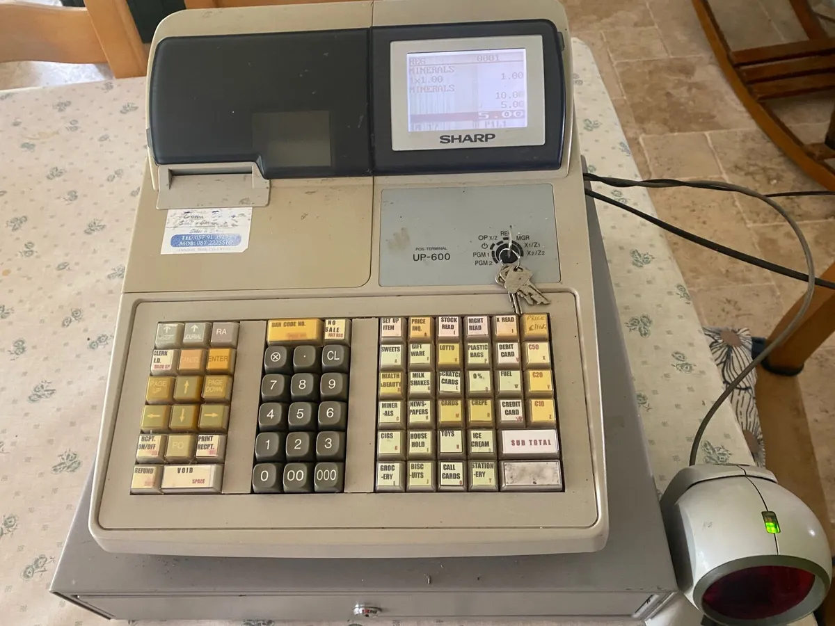 Cash register with scanner