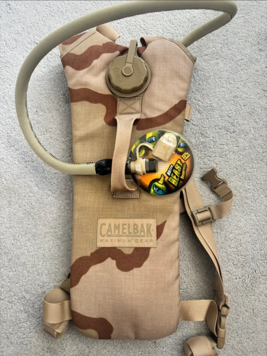 Camelbak maximum gear hydration pack in desert - Image 1