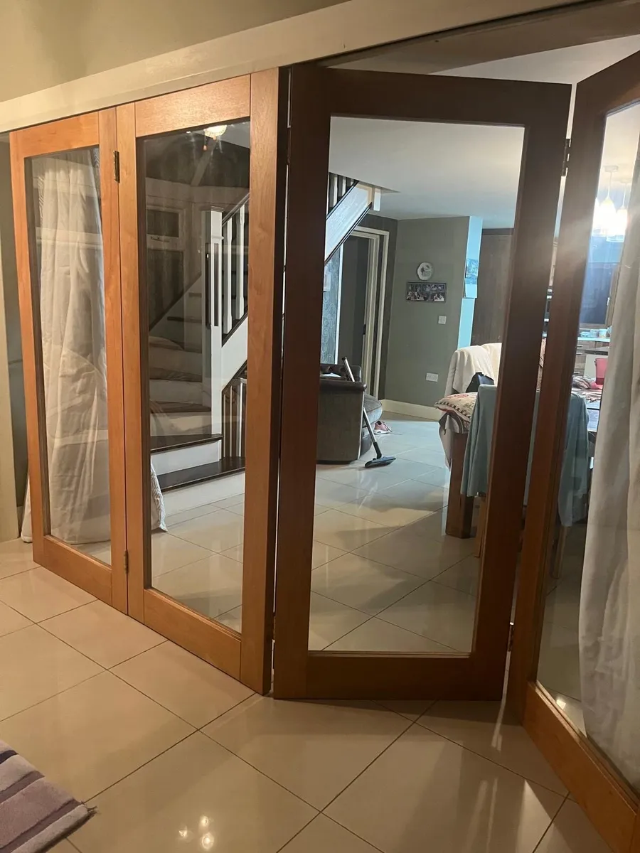 Internal bi folding wallnut doors - Image 1