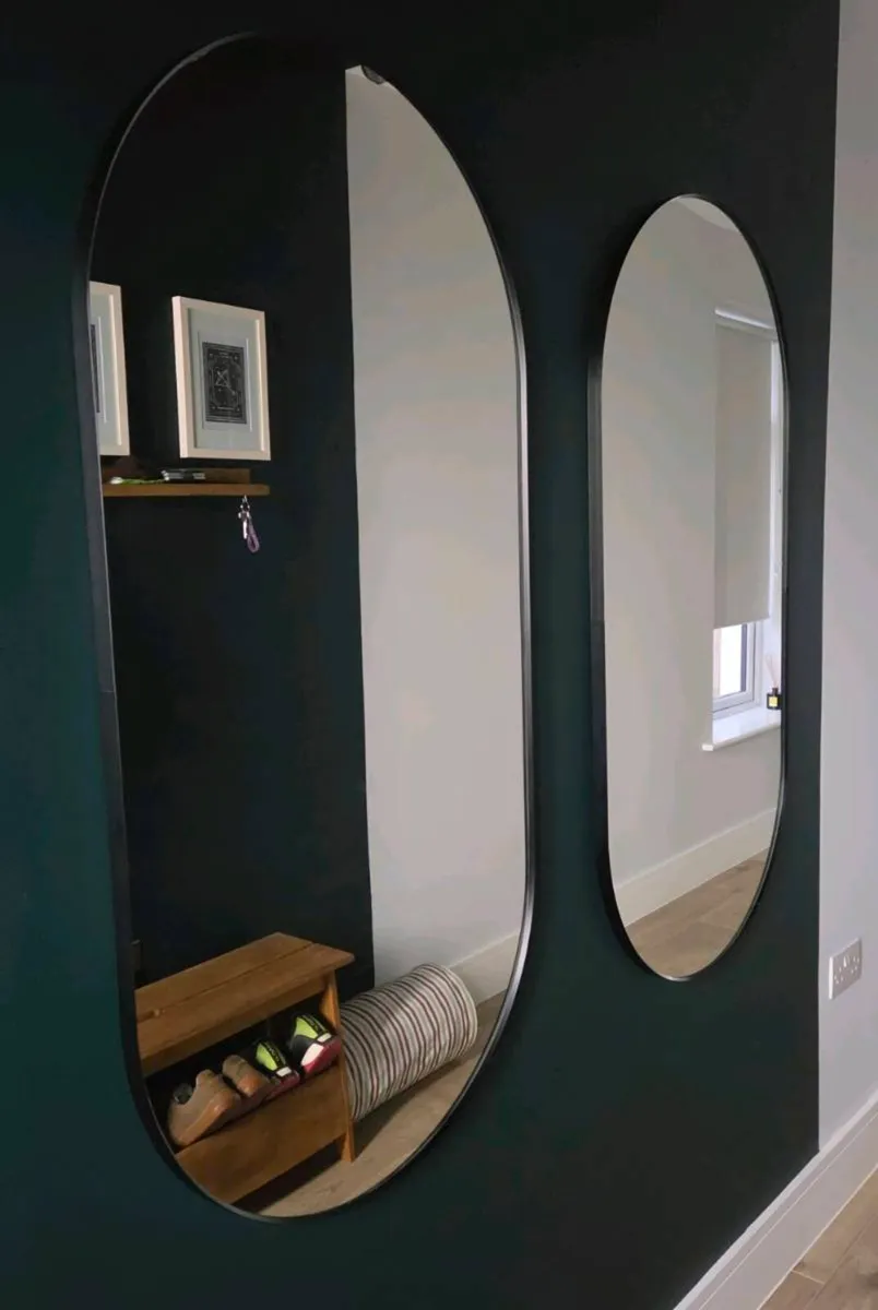 Two Black Framed Mirrors