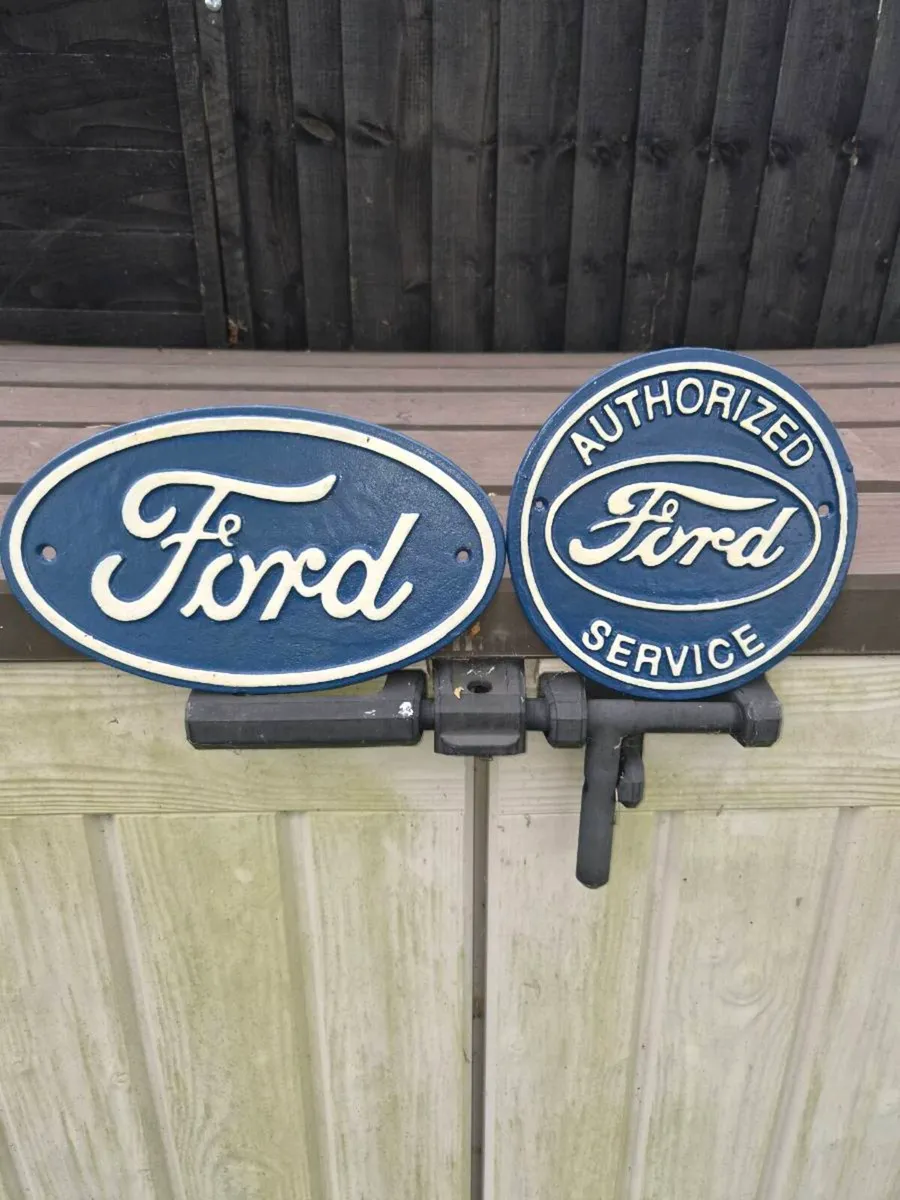 2 Ford  cast iron signs €40 each