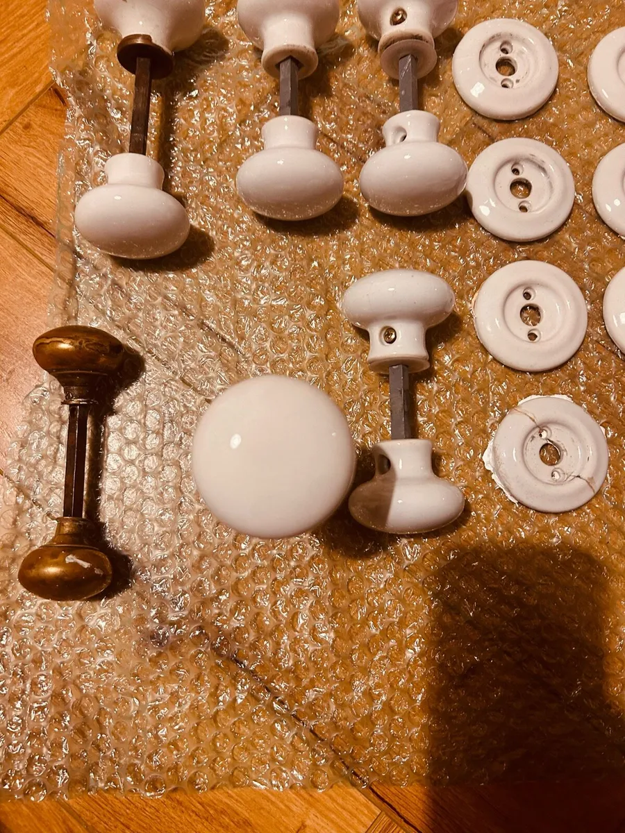 White Porcelain Mortice Knobs + 1 small brass knob - Image 1