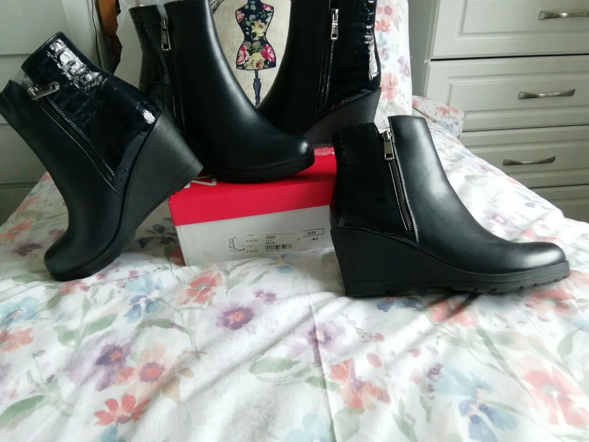 2 pair of the same navy boots.