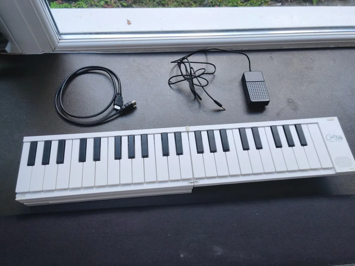 Folding Piano - Image 1