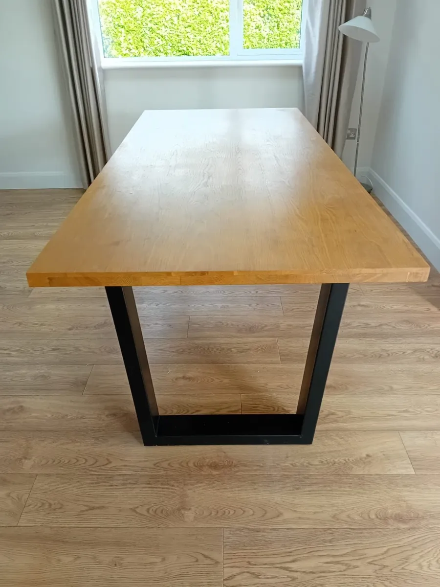 Large oak dinning room table with black metal legs - Image 1