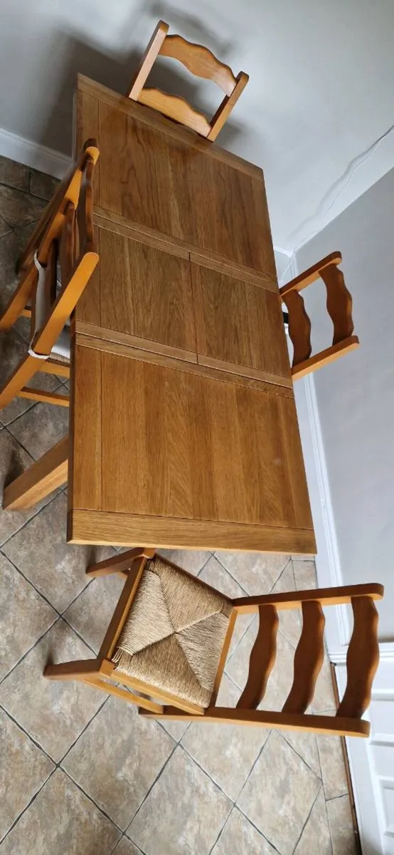 Expanding solid oak dinning table and four chairs. - Image 2