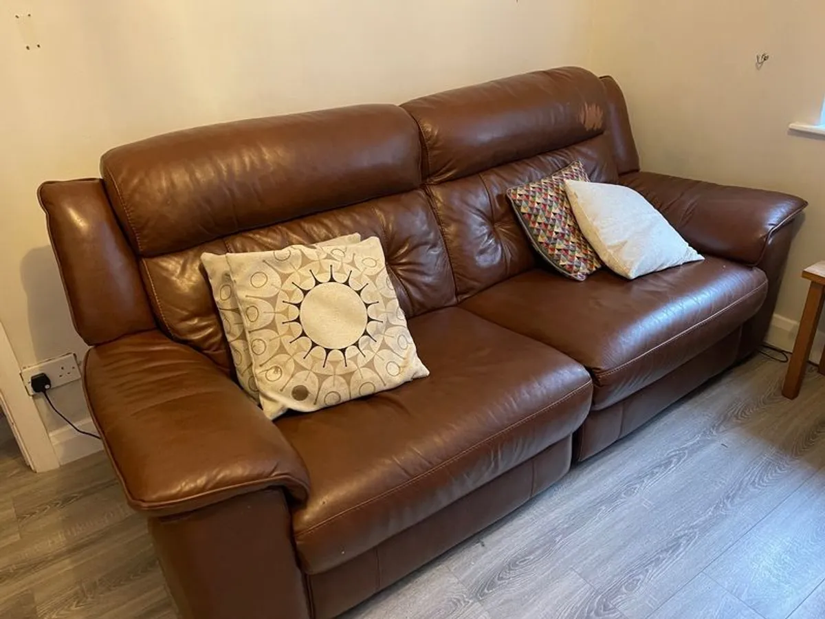 Leather electric recliner sofa with matching armchair and footstool - Image 1
