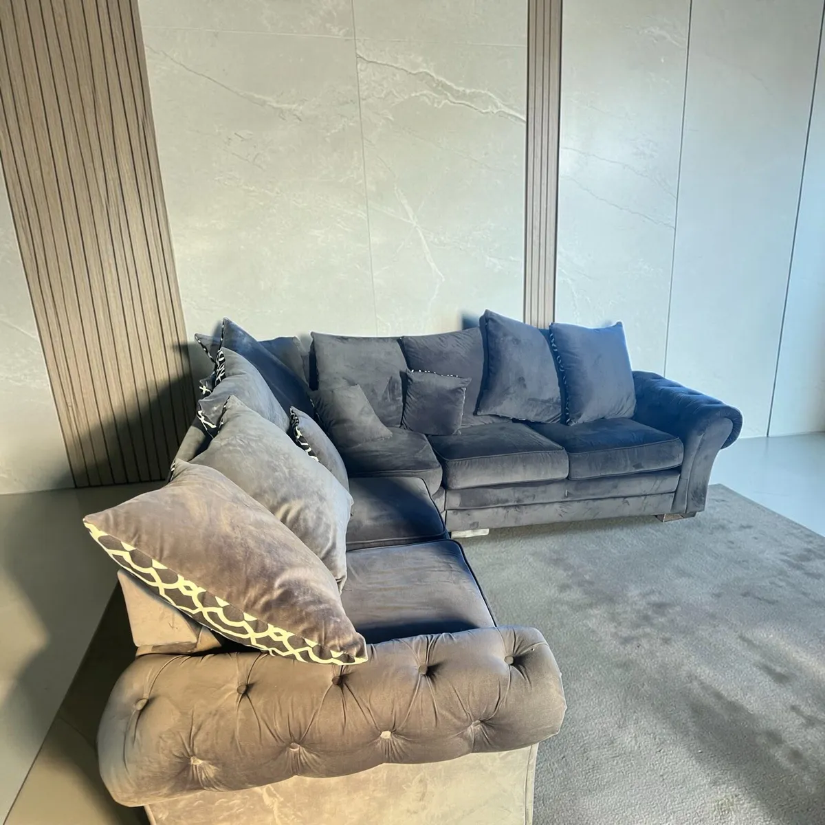 Grey corner sofa with scatter cushions - Image 1