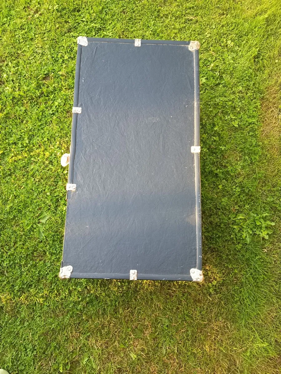 Black storage trunk with red patterned lining - Image 4