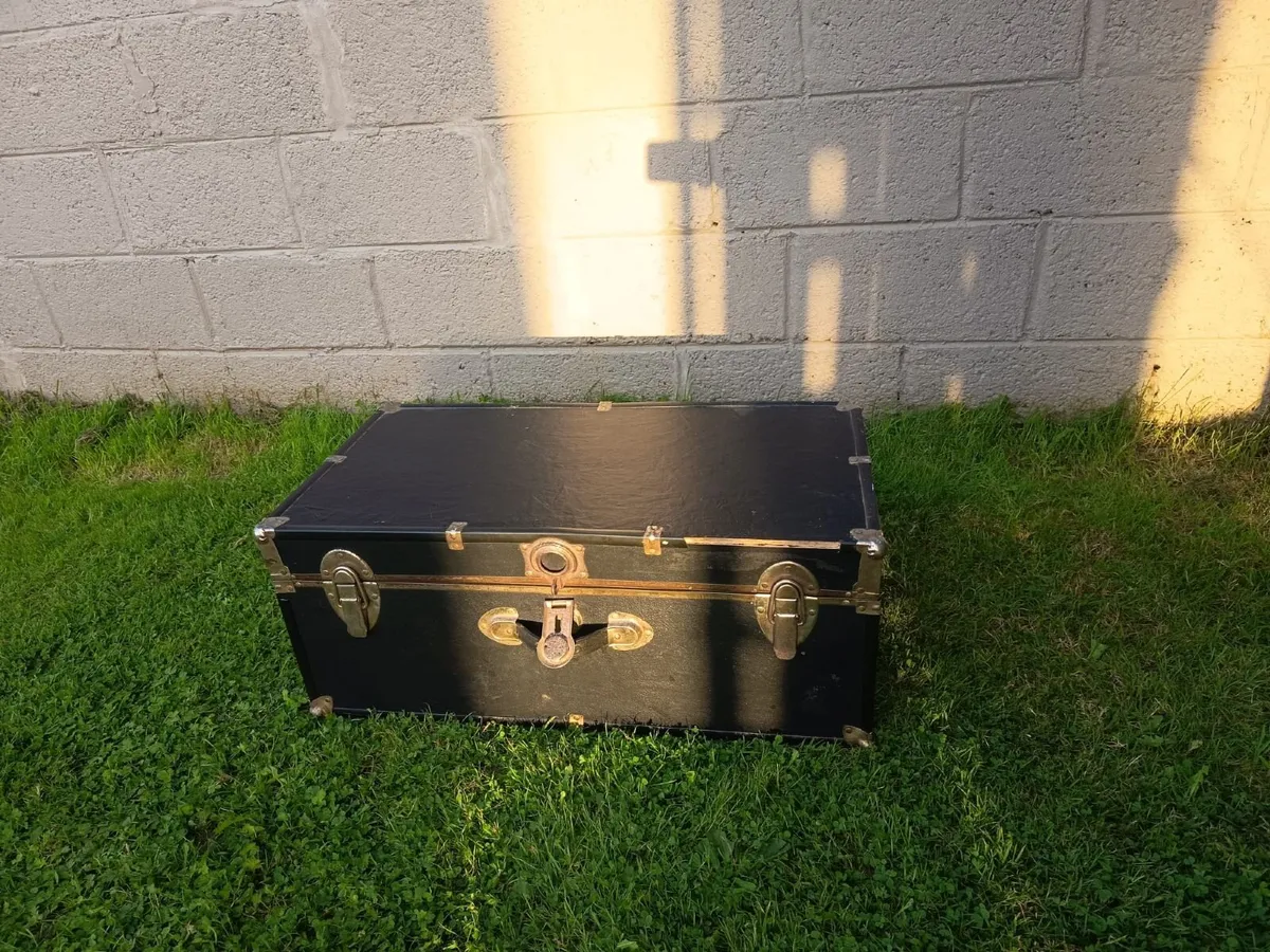 Black storage trunk with red patterned lining - Image 1