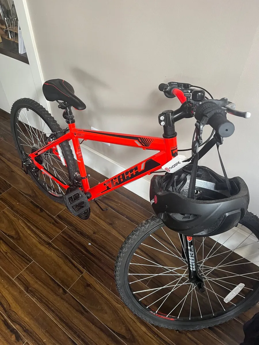 Bicycle and helmet - Image 1