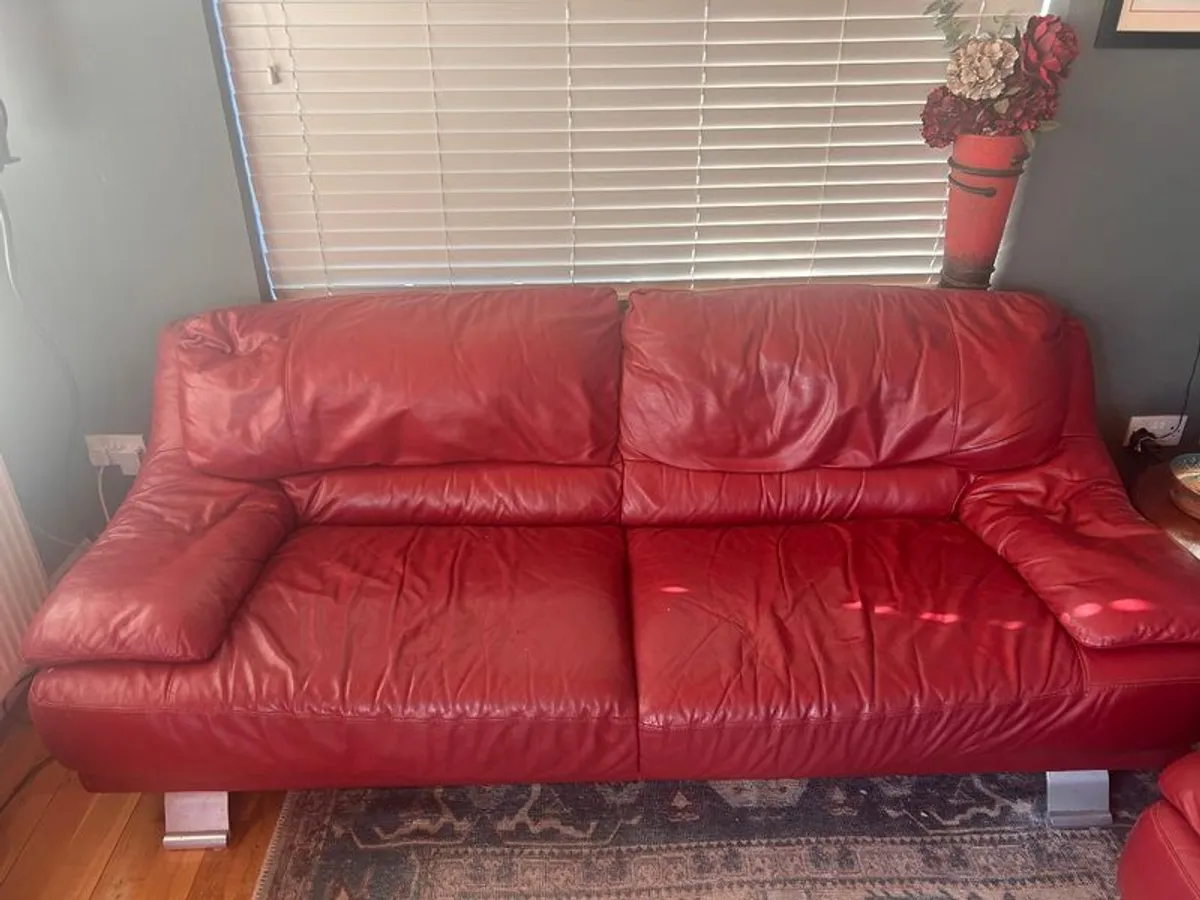 Red leather sofas x 2 plus ottoman - Image 1