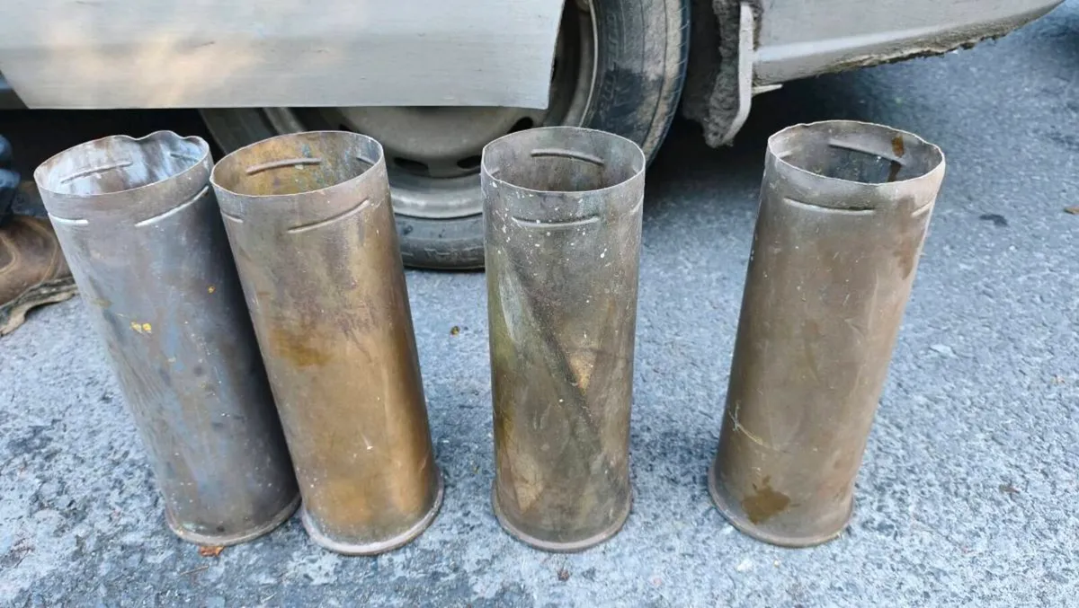 four spent, empty brass artillery shell casings
13 - Image 1