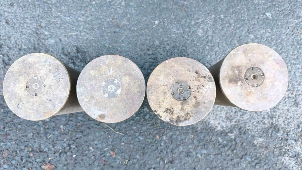four spent, empty brass artillery shell casings
13 - Image 4