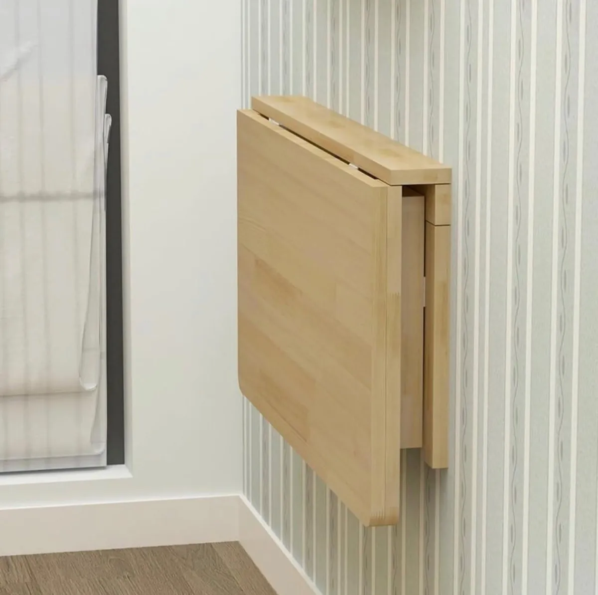 Wall mounted folding table
