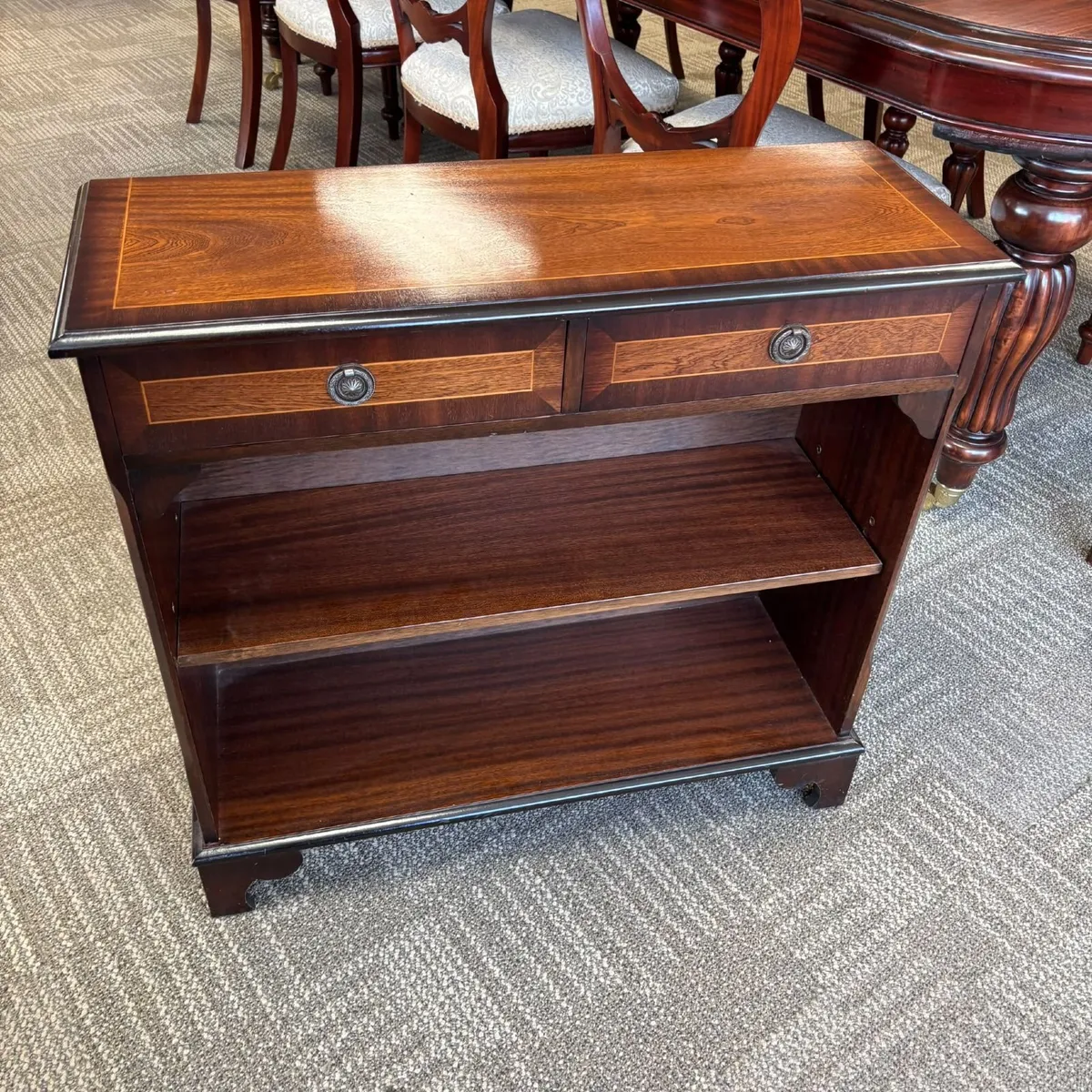 An attractive vintage-style open bookcase featurin