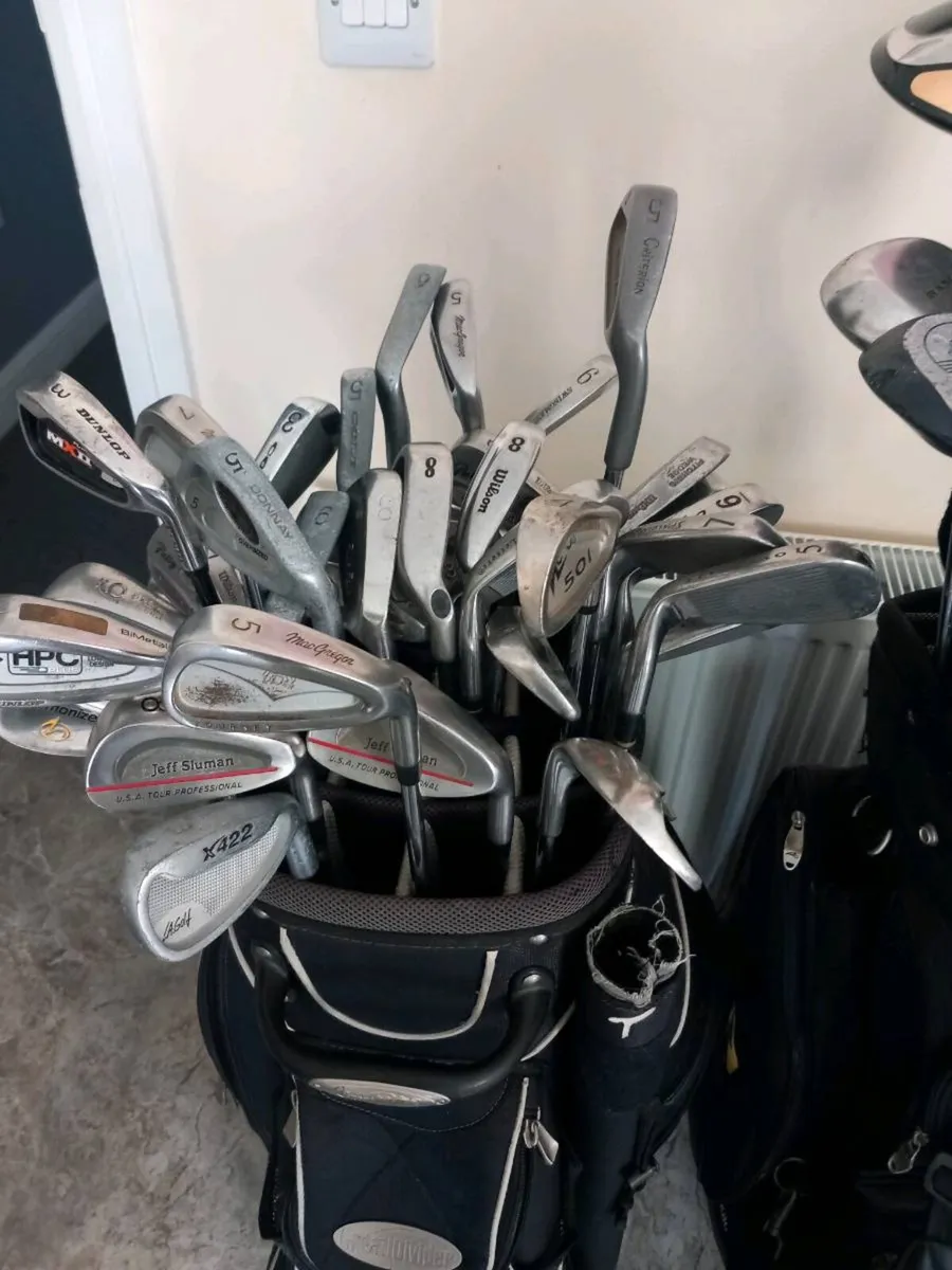 A selection of golf clubs and bags. - Image 3