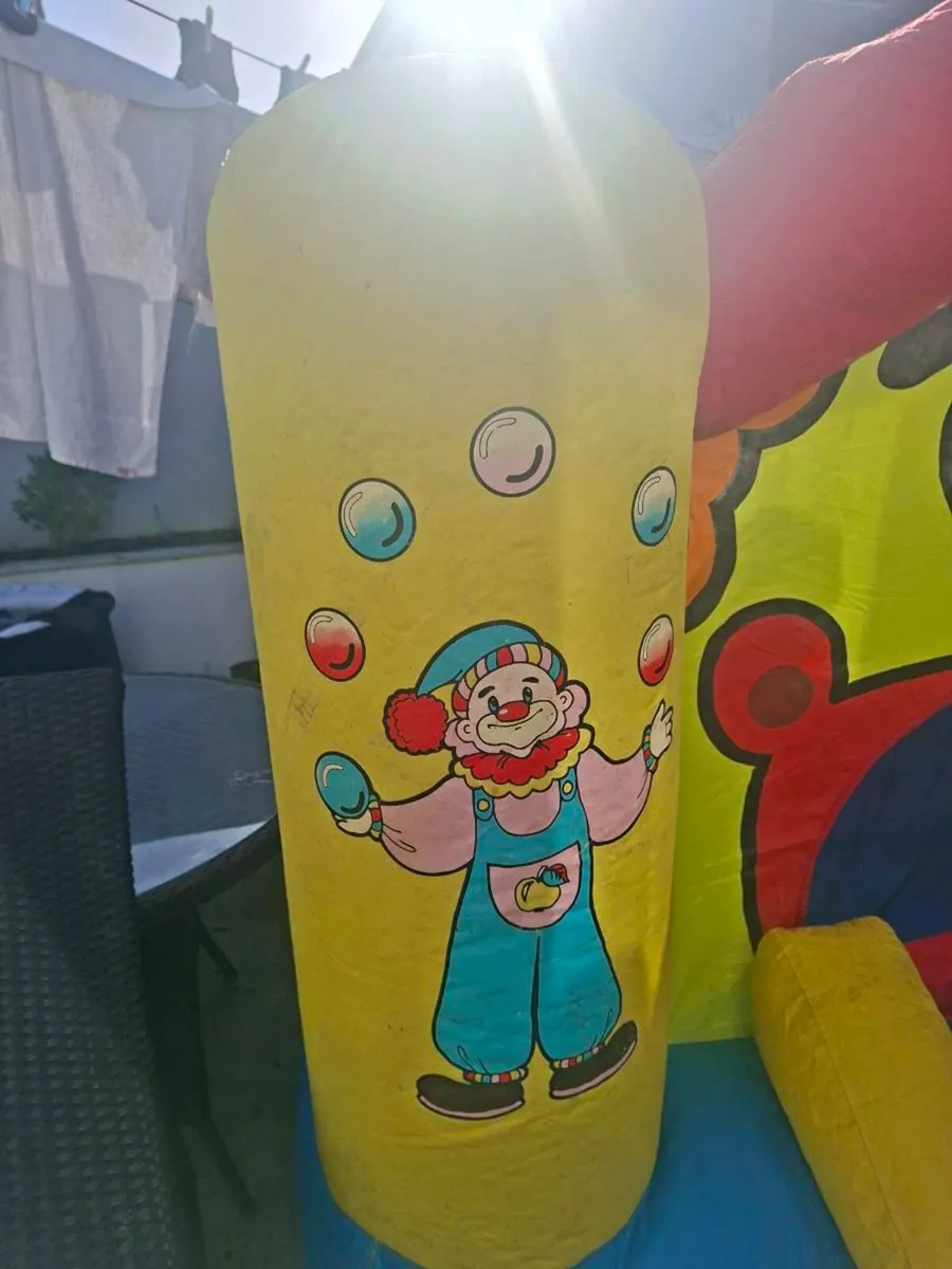 Happy Hop clown-themed bouncy castle with blower - Image 2