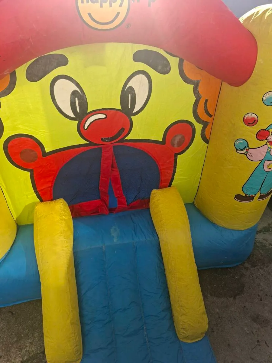 Happy Hop clown-themed bouncy castle with blower - Image 3