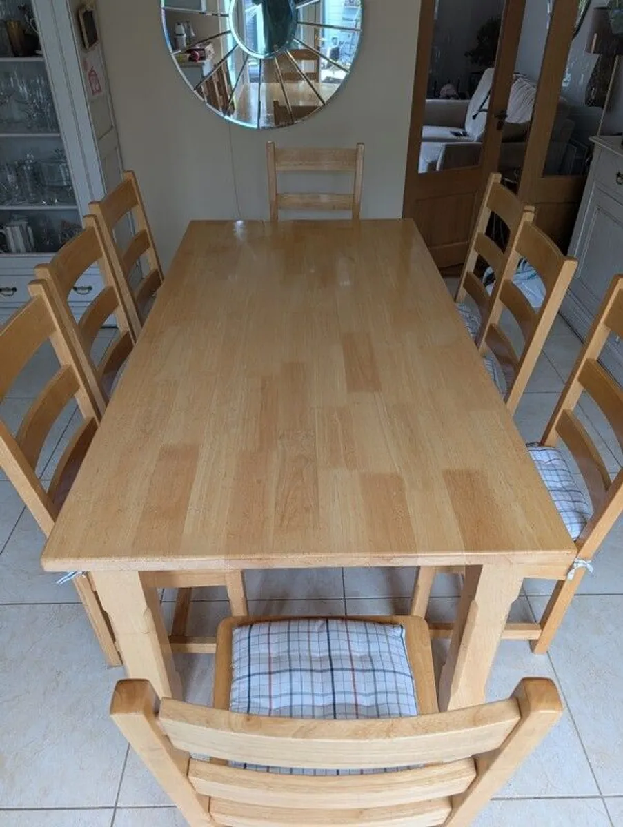 8 seater wooden dining table and chairs - Image 1