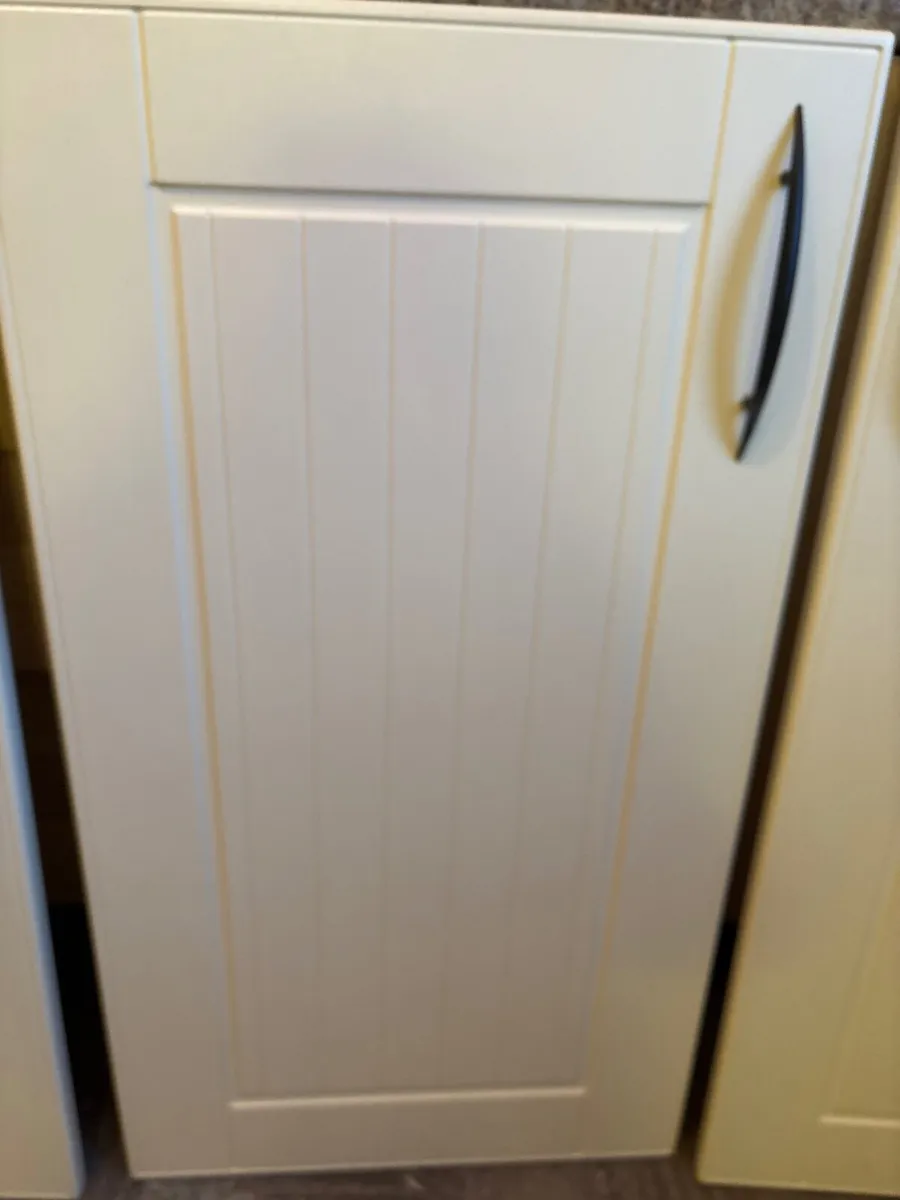 Cream coloured  cabinet doors with black handles - Image 2