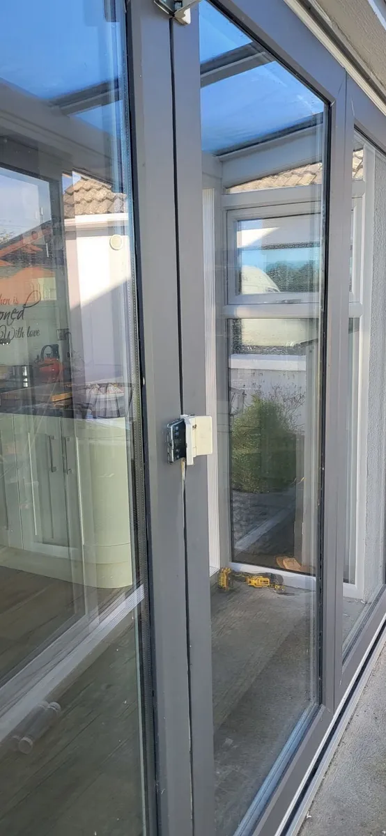 Large white bifold pvc door ,grey wrap on outside - Image 2
