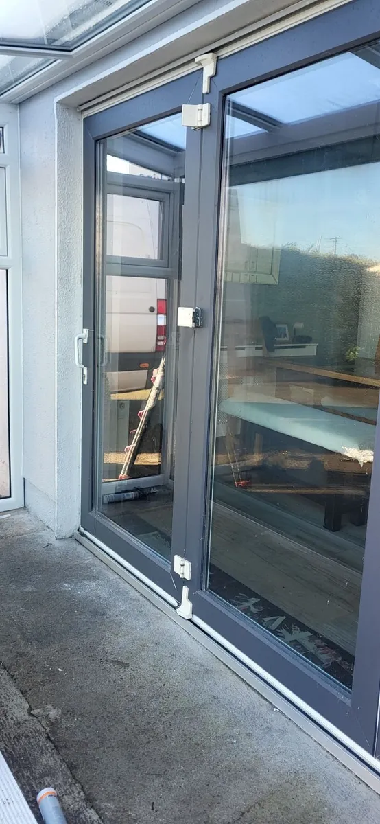 Large white bifold pvc door ,grey wrap on outside - Image 4