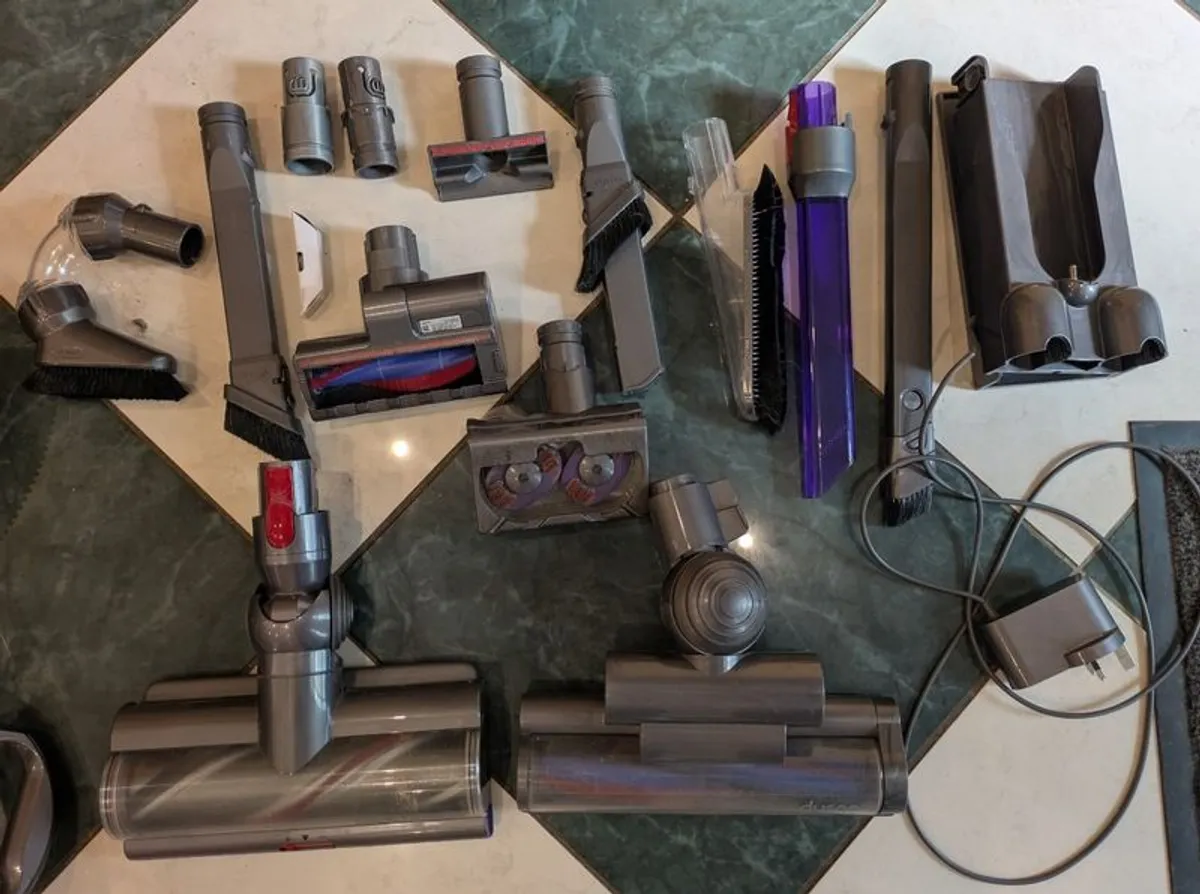 Two Dyson Vacuum Cleaners and accessories - Image 1