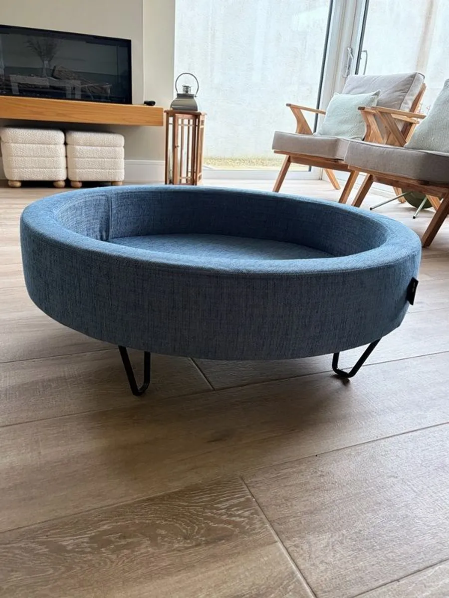 Large Round Blue Ottoman / Footstool with Storage  Stylish round ottoman with a dark denim-blue cushioned top, textured lighter blue base and black metal legs.  The top lifts off to reveal a handy storage space. Perfect as a footstool or styled with a tra - Image 3
