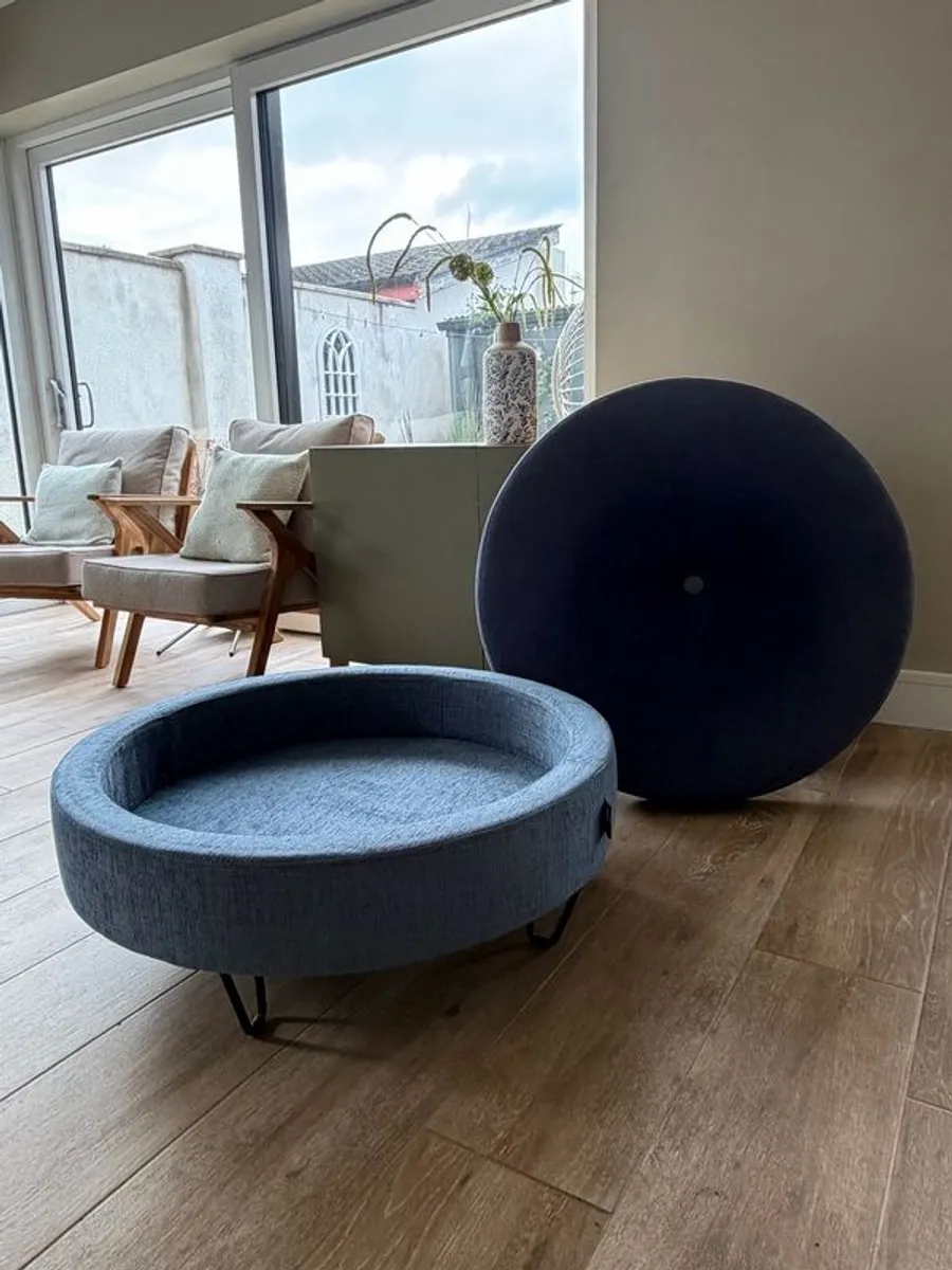 Large Round Blue Ottoman / Footstool with Storage  Stylish round ottoman with a dark denim-blue cushioned top, textured lighter blue base and black metal legs.  The top lifts off to reveal a handy storage space. Perfect as a footstool or styled with a tra - Image 4