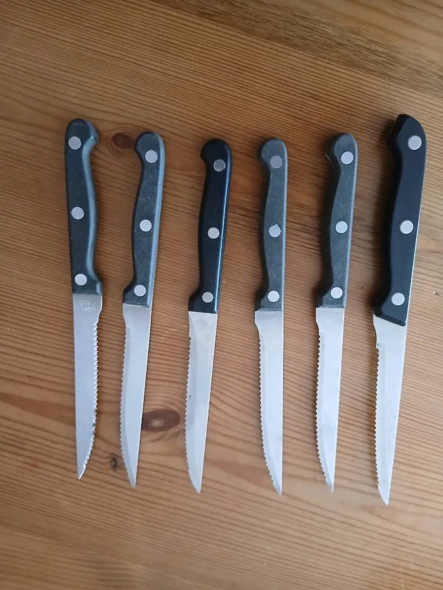 A 12-piece stainless steel steak knife fork set. - Image 4