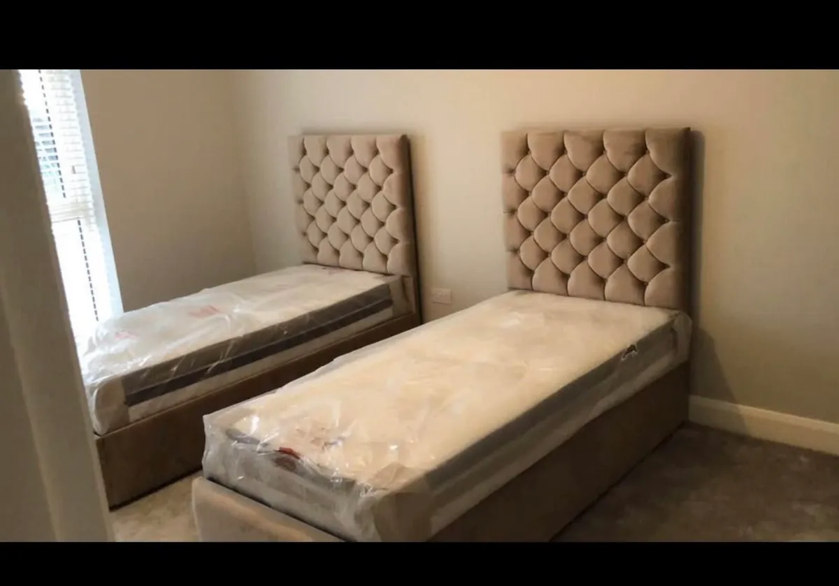 2 single beds with mattresses