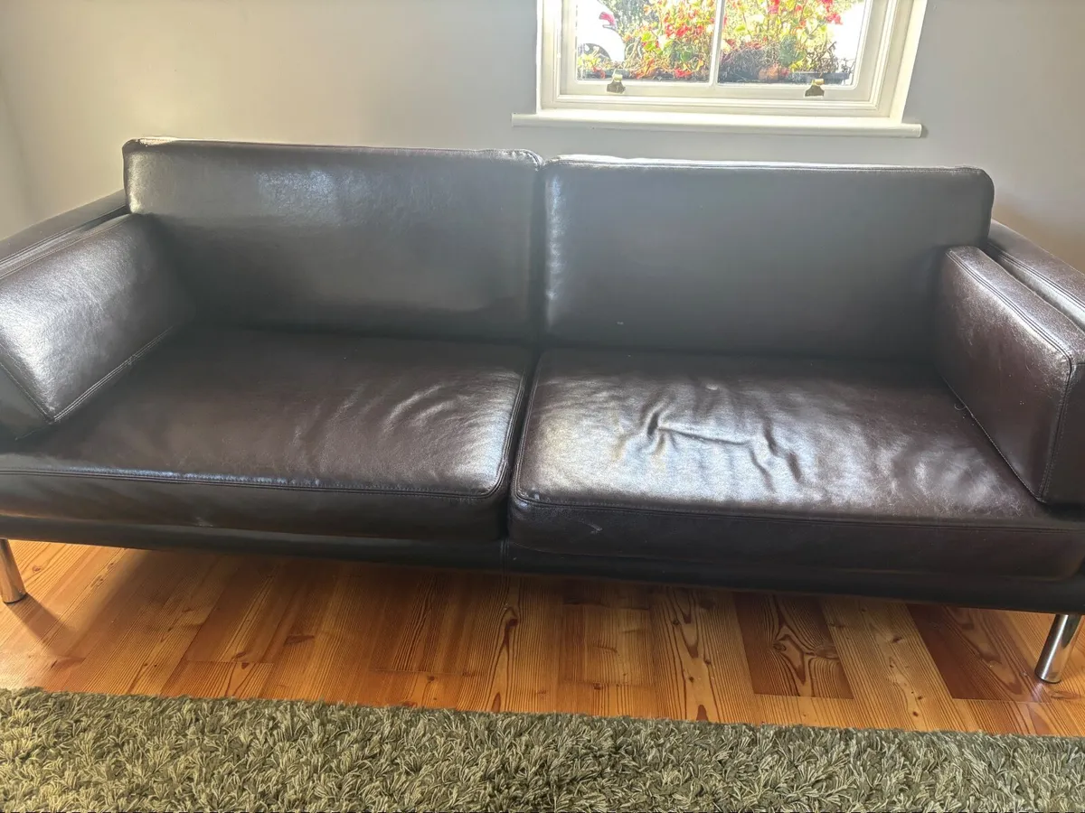 Dark brown synthetic leather sofa with chrome legs