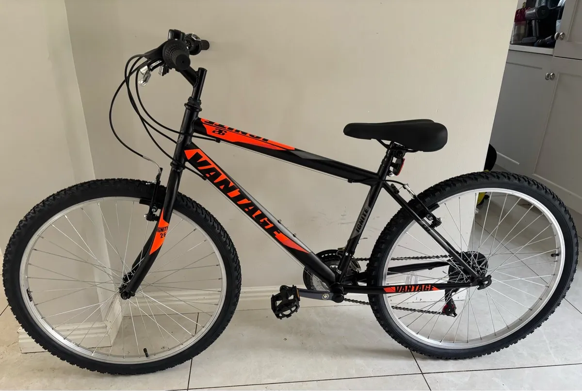 brand new bicycle and helmet - Image 1