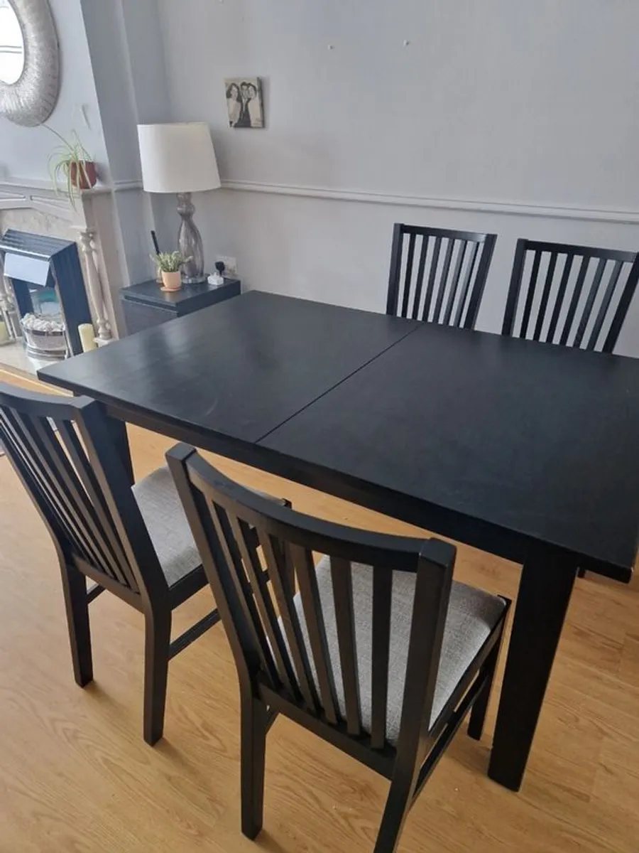Black dining table with four chairs - Image 1