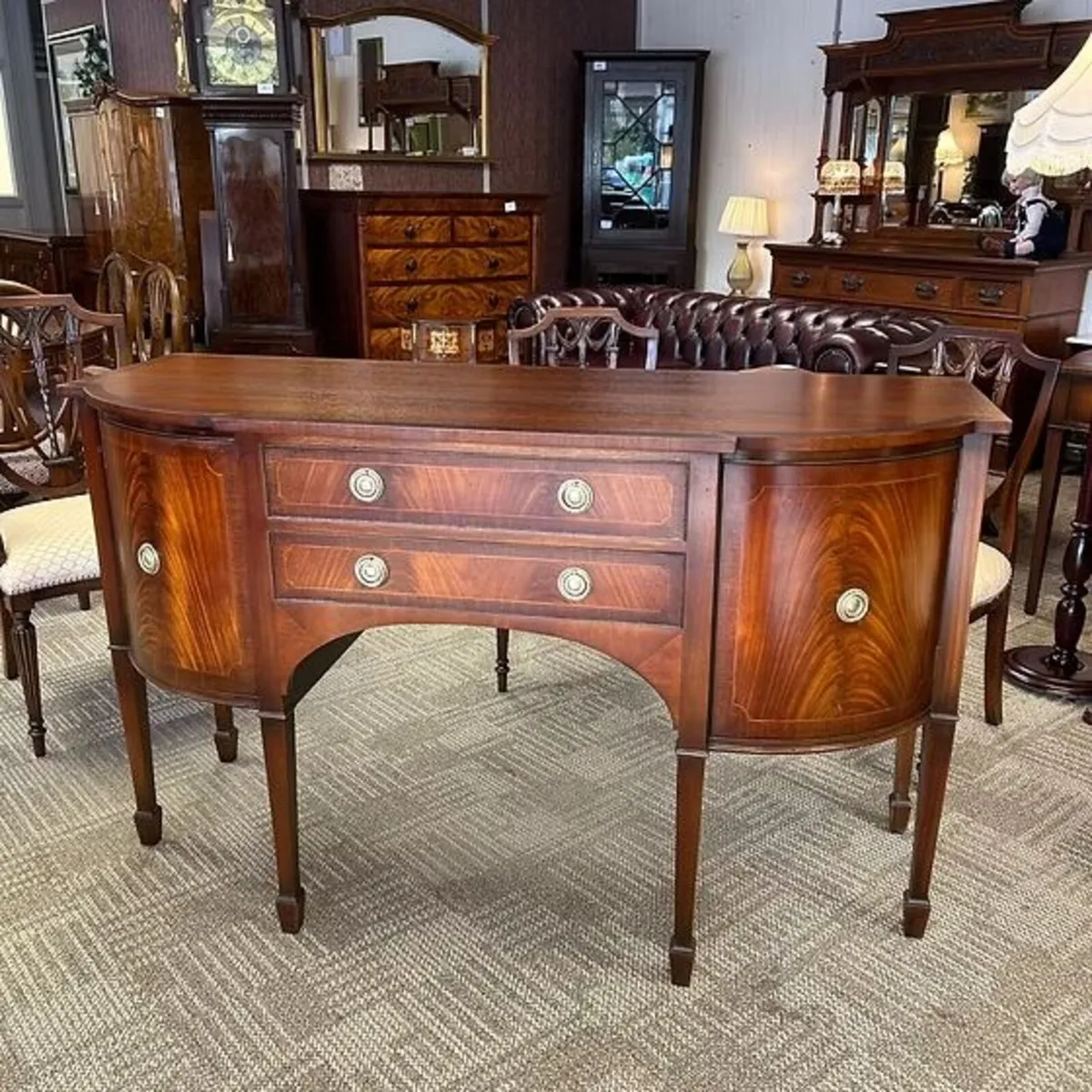 A beautiful breakfront mahogany apron sideboard