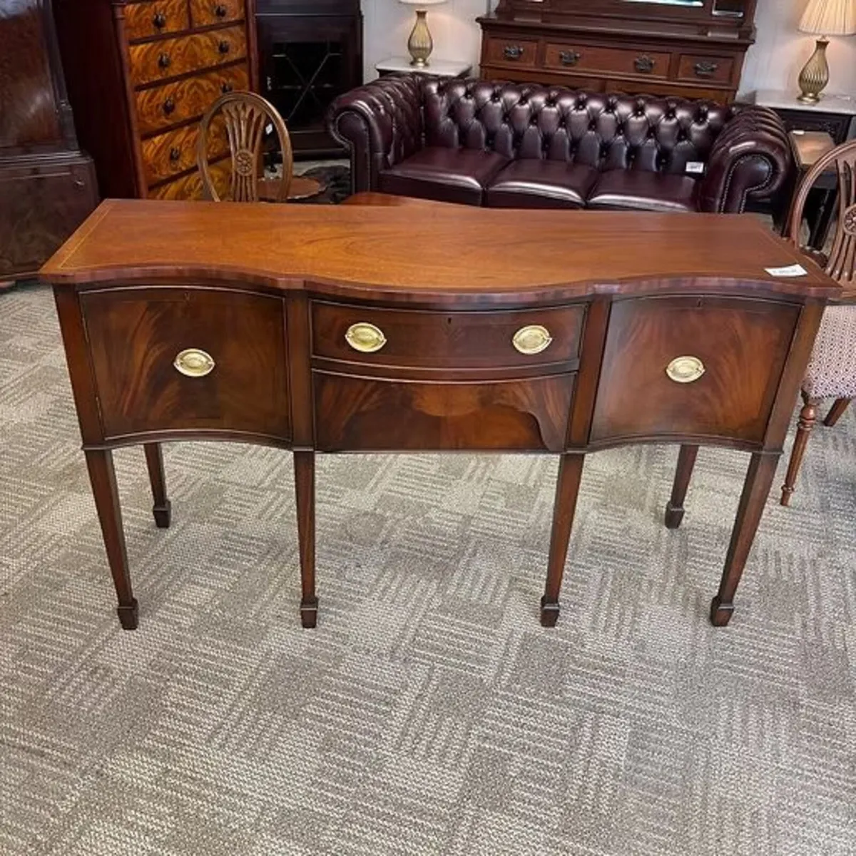 Fabulous mahogany flamed serpentine bow fronted si