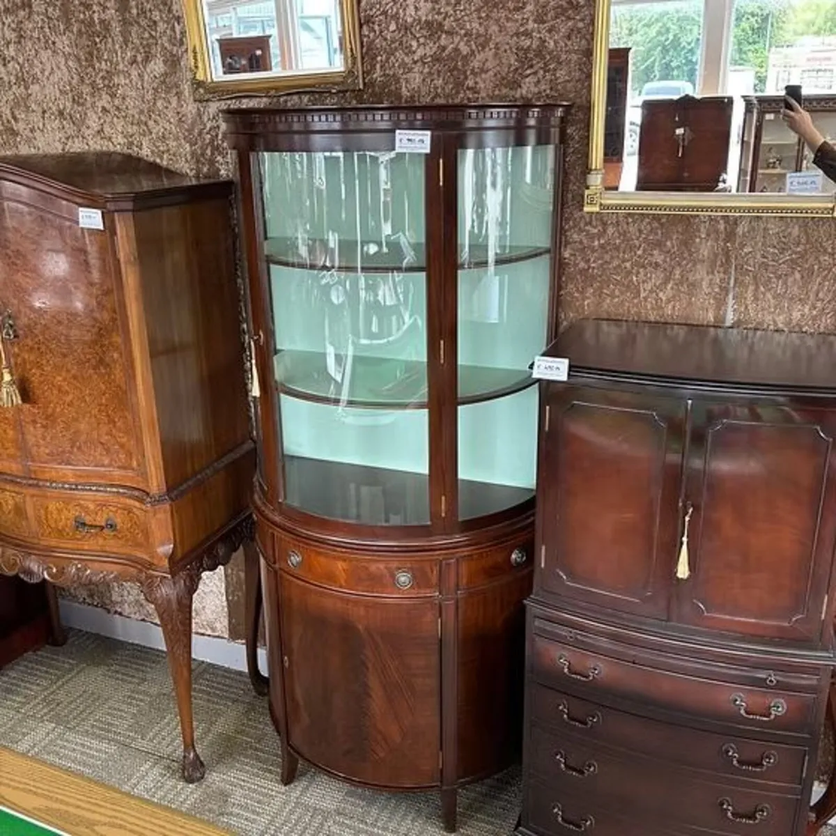Mahogany bow-front display cabinet