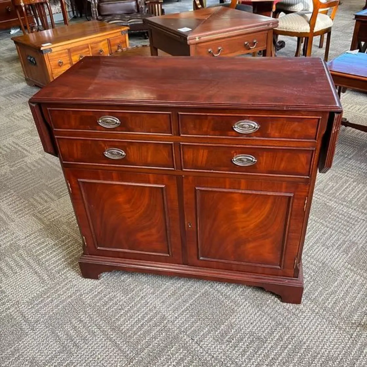 An traditional butlers drop leaf sideboard