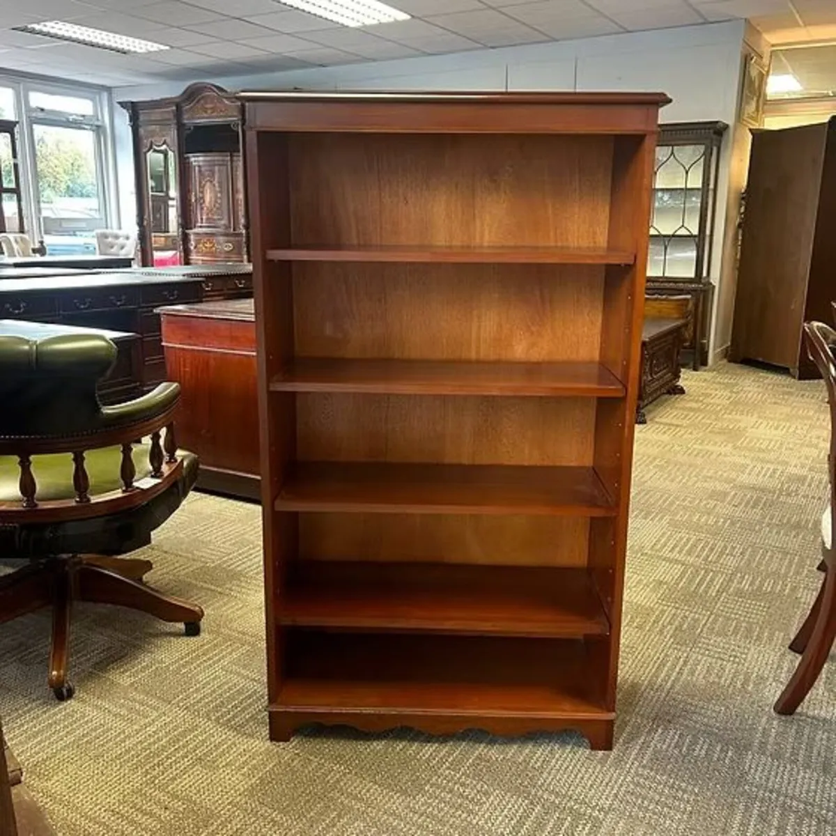 A beautiful mahogany open bookcase with four adjus