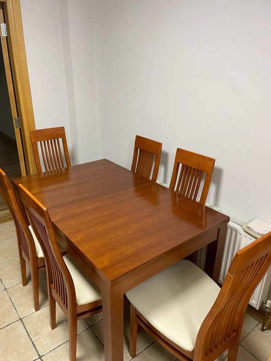 Kitchen dining table and 6 white chairs - Image 1